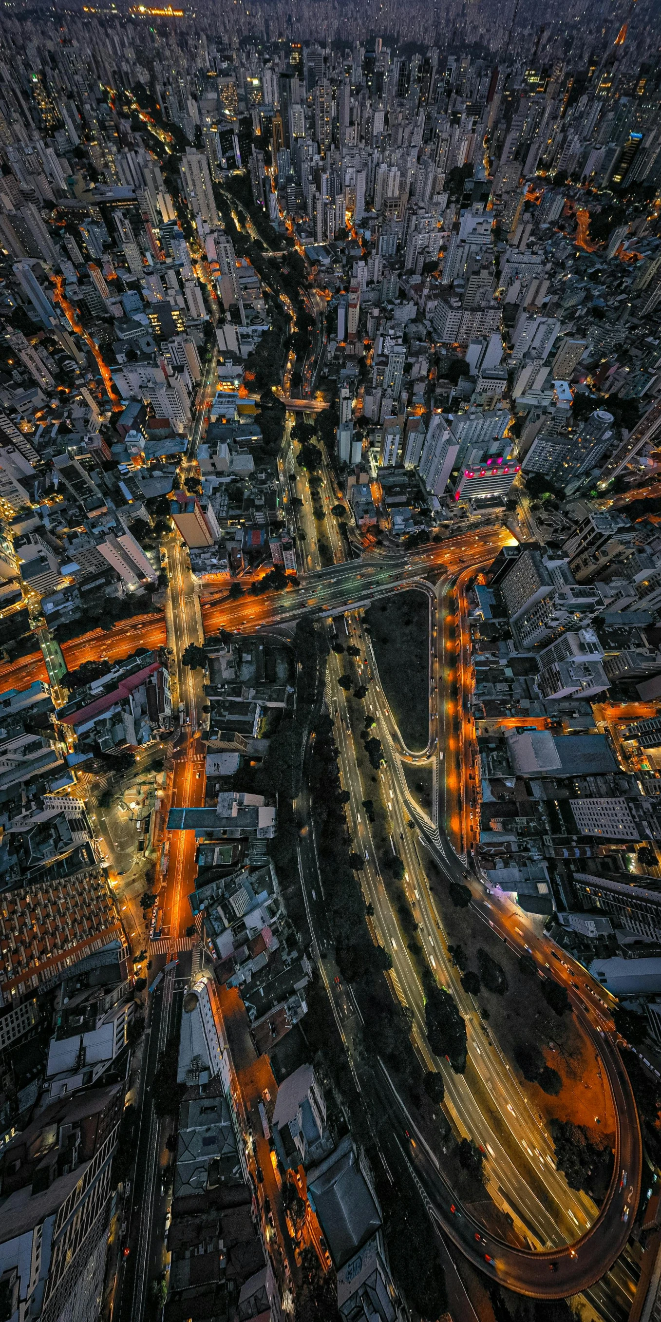 an aerial view of a city at night, an album cover, by Reuben Tam, unsplash contest winner, bangkok, intersection, hyperdetailed, taken at golden hour