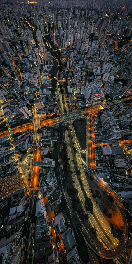 an aerial view of a city at night, an album cover, by Reuben Tam, unsplash contest winner, bangkok, intersection, hyperdetailed, taken at golden hour