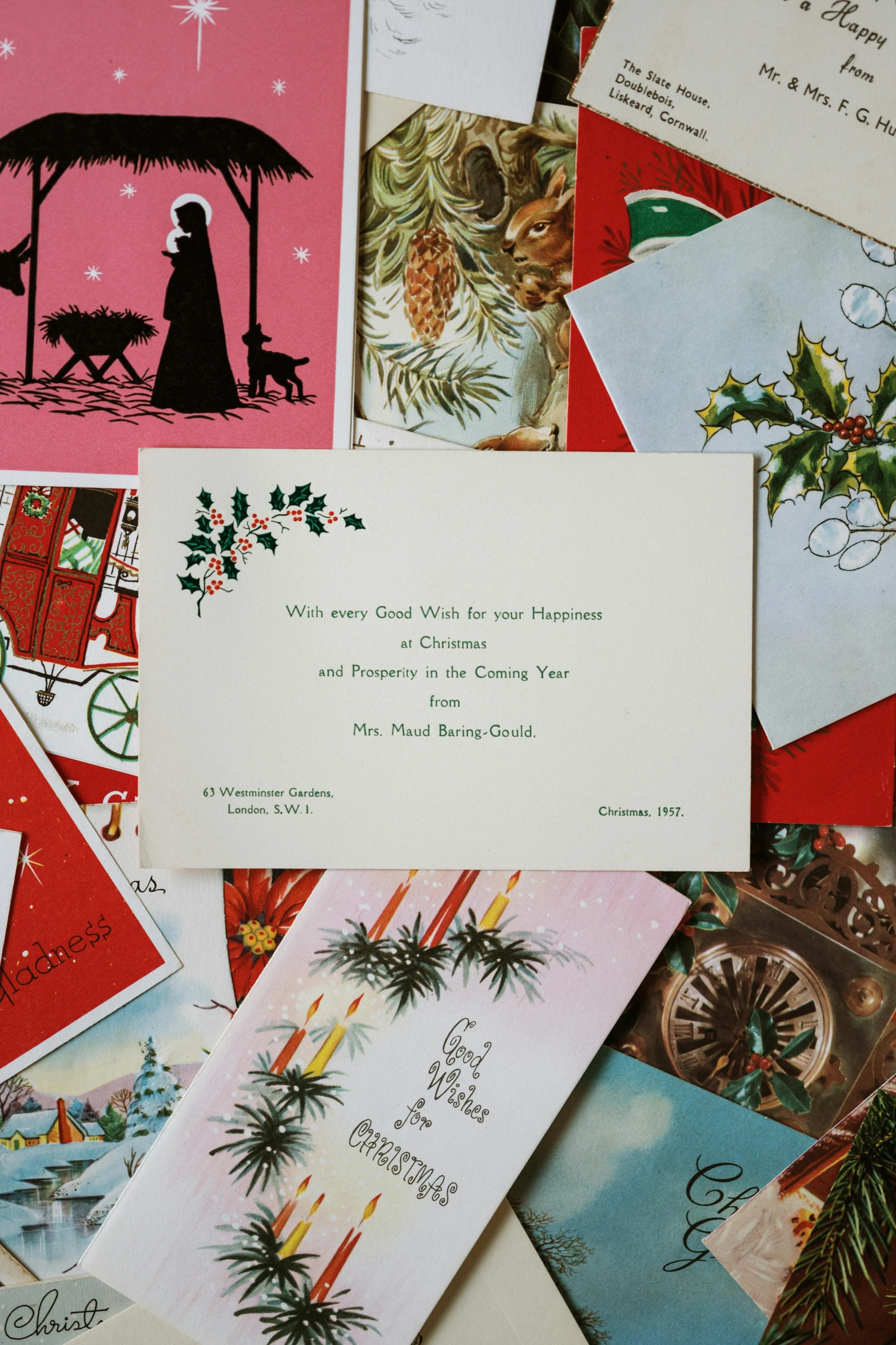 a pile of christmas cards sitting on top of a table, by Everett Warner, folk art, promo image, invitation card, contain, paul rand