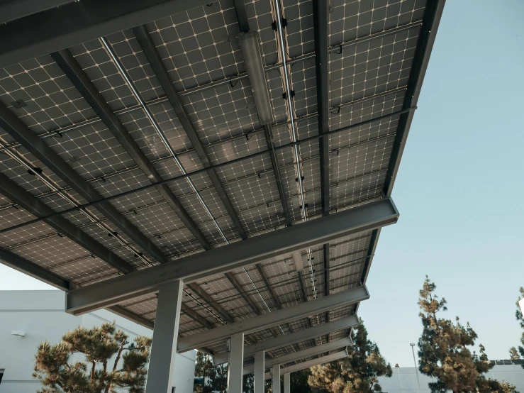 a solar panel on the roof of a gas station, by Carey Morris, unsplash contest winner, bauhaus, canopies, a park, perfectly shaded, 15081959 21121991 01012000 4k