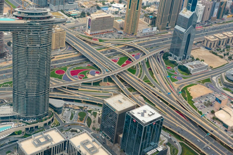 a large city filled with lots of tall buildings, by Meredith Dillman, pexels contest winner, visual art, highways, gta : dubai, hyper - detailed color photo, intersection