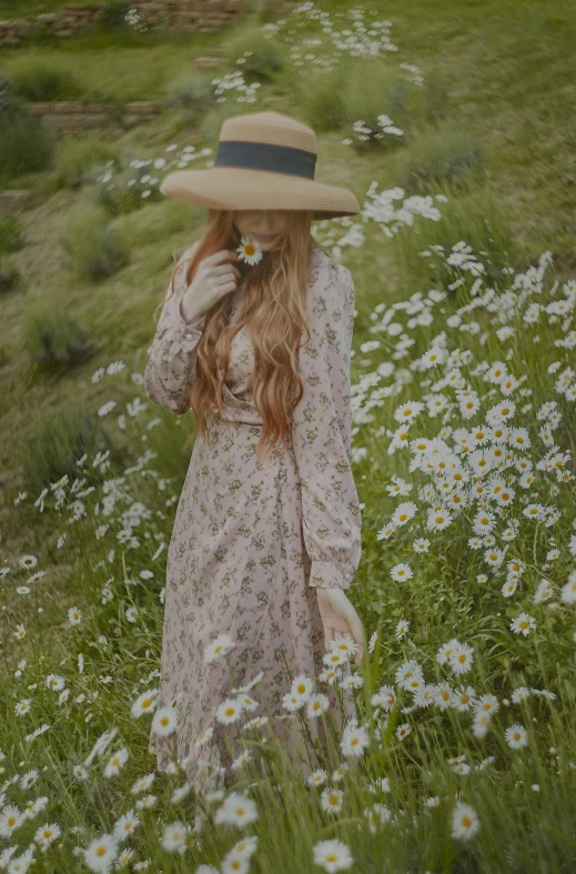 a woman standing in a field of flowers, inspired by Oleg Oprisco, trending on pexels, renaissance, holding daisy, with hat, cottagecore hippie, long ginger hair