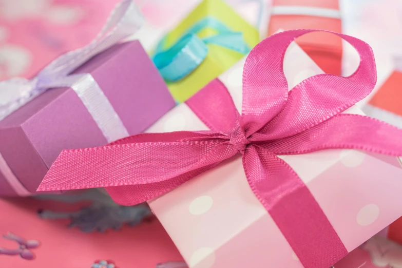 a close up of a gift box with a pink ribbon, by Alice Mason, pexels contest winner, happening, colourful pastel, panoramic shot, avatar image, fan favorite