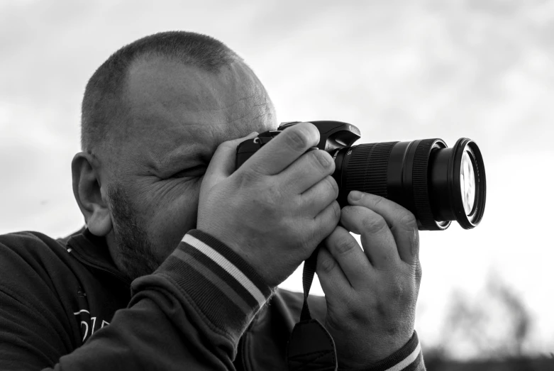 a man taking a picture with a camera, a black and white photo, pixabay contest winner, 4 0 0 mm f 1. 8, photographic print, head shoot, amateur photography