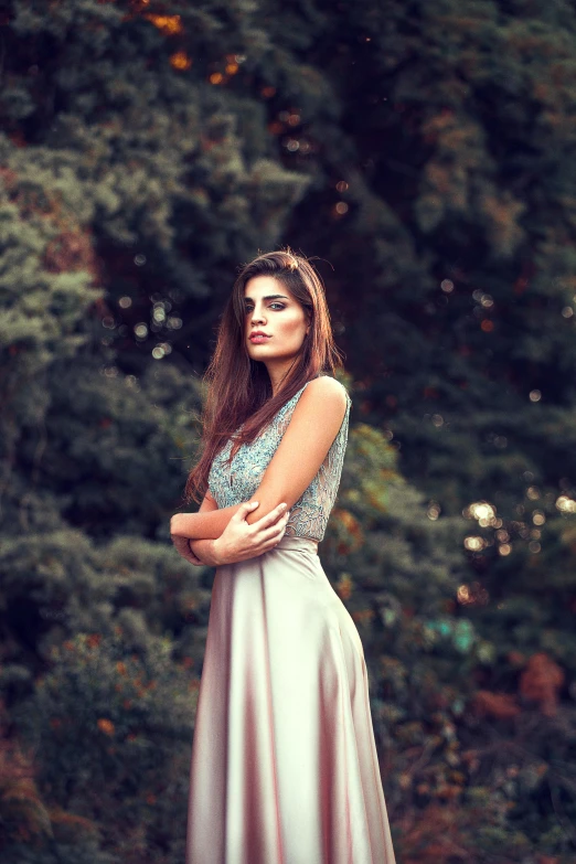 a woman in a long dress standing in front of a forest, inspired by Elsa Bleda, pexels contest winner, handsome girl, beautiful iranian woman, 5 0 0 px models, concert