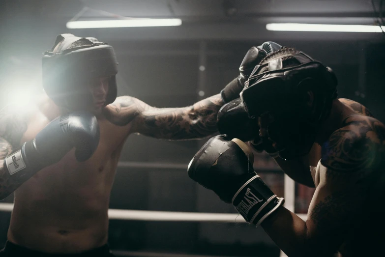 a couple of men standing next to each other in a boxing ring, pexels contest winner, happening, sparring, lachlan bailey, [ theatrical ], hard lighting