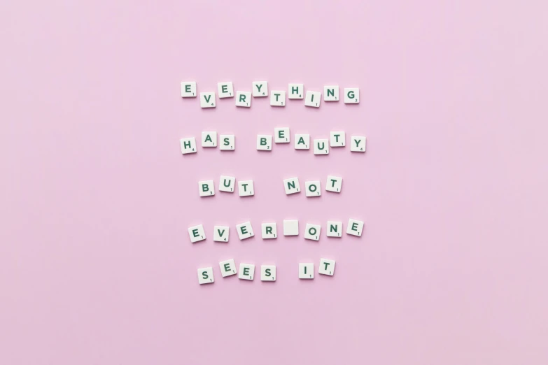 a pink background with the words everything has beauty but not everyone has it, aestheticism, building blocks, letters, flatlay, background image