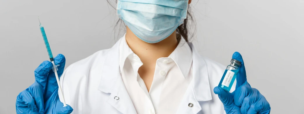 a close up of a person wearing gloves and a mask, wearing lab coat and a blouse, soft chin, nurse costume, healthcare