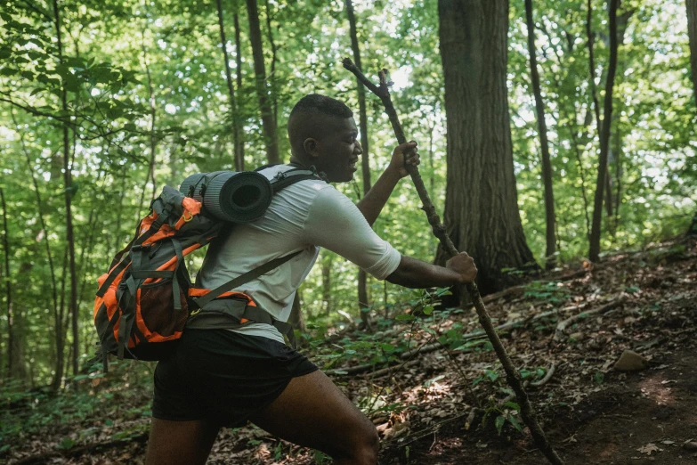 a man with a backpack is hiking through the woods, a portrait, pexels contest winner, renaissance, holding a thick staff, athlete photography, avatar image, thumbnail