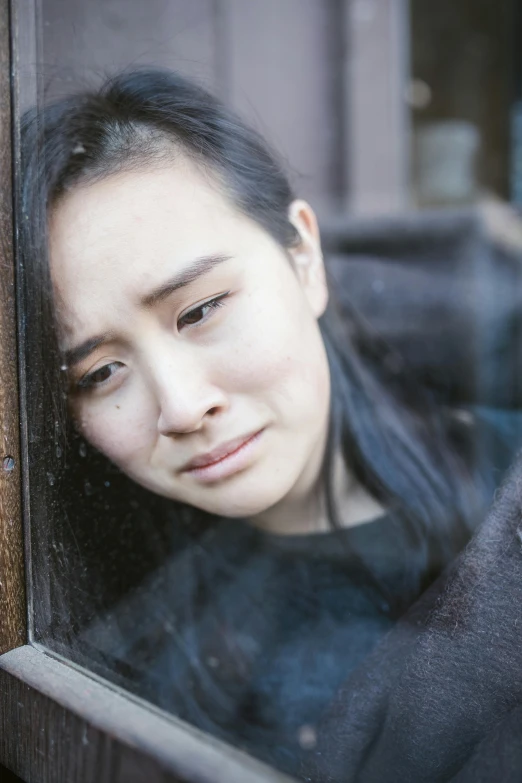 a close up of a person looking out a window, inspired by Yu Zhiding, young asian woman, sad grumpy face, leaning on door, promo image