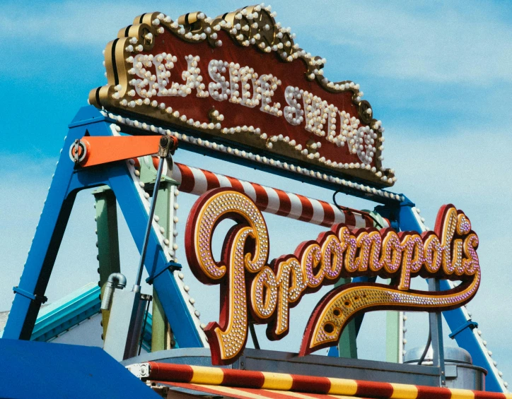 a carnival ride with a sign that says poopopopopopopopopopopopopopopopopopopop, by Carey Morris, trending on unsplash, seaside, intricate hyper detail, trypophobia, old signs