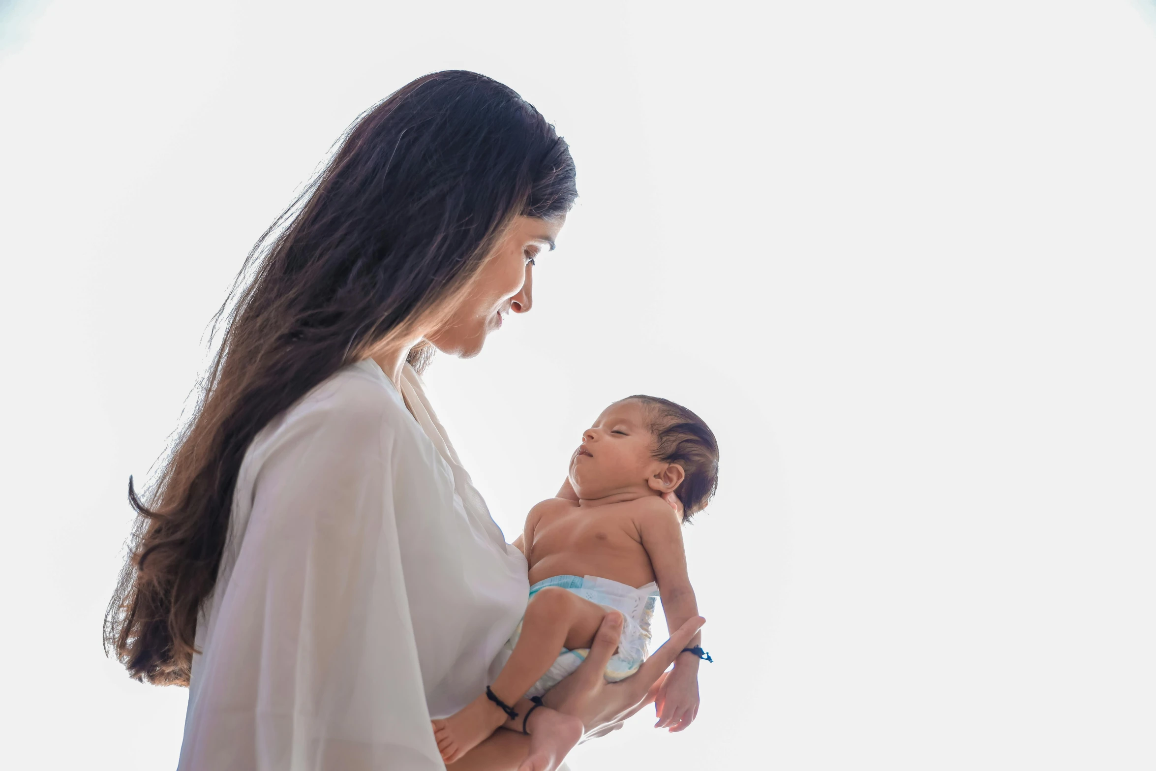 a woman holding a baby in her arms, an album cover, by Judith Gutierrez, pexels contest winner, hurufiyya, avatar image, super high resolution, profile pic, extremely high resolution