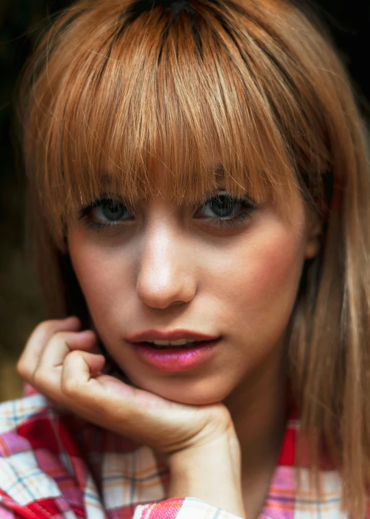 a woman posing for a picture with her hand on her chin, inspired by Ksenia Milicevic, hipster hair fringe, blank stare”