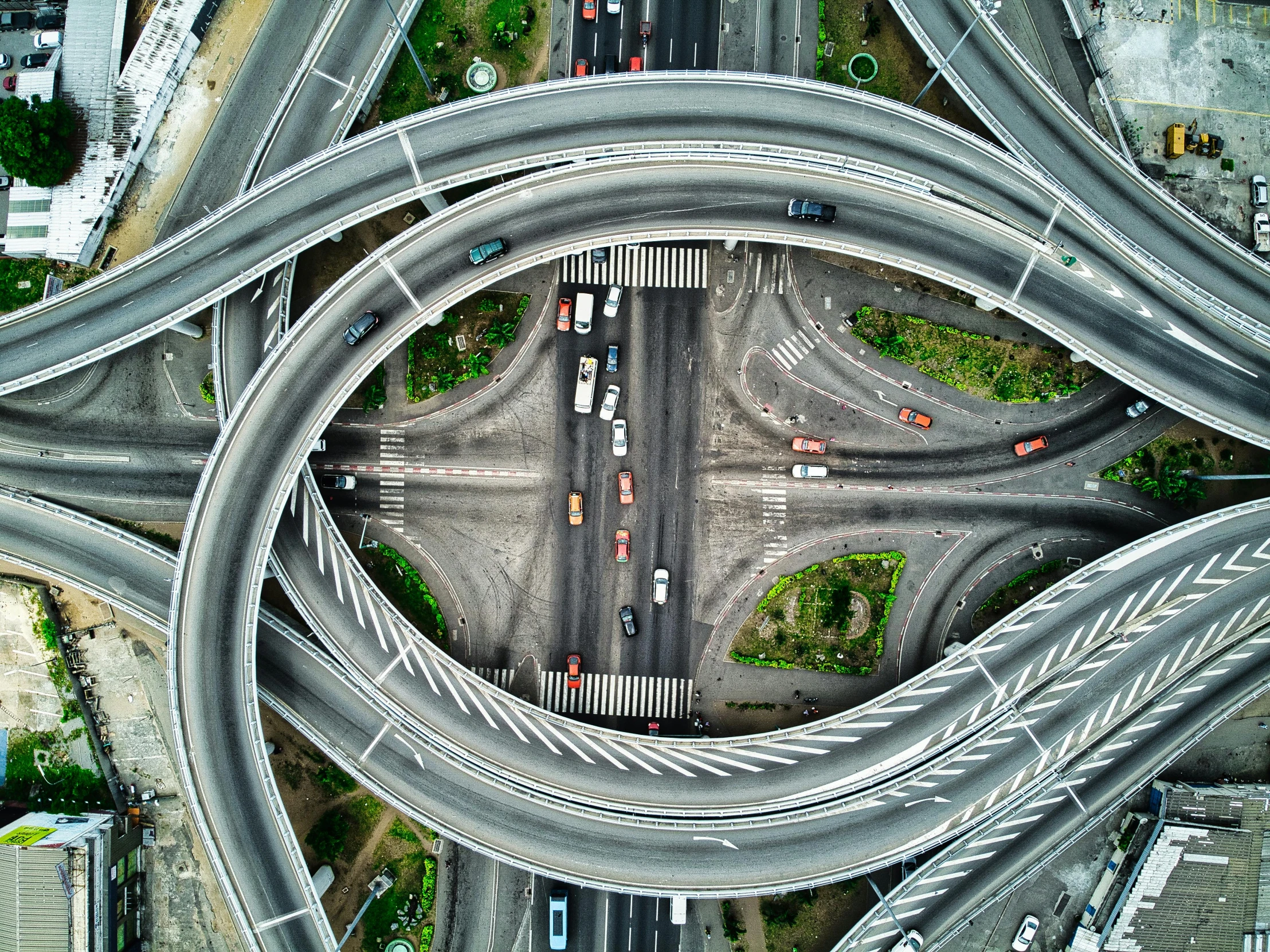 an aerial view of a busy highway intersection, by Adam Marczyński, pexels contest winner, photorealism, curving geometric arches, multi layered huge architectures, snapchat photo, ilustration