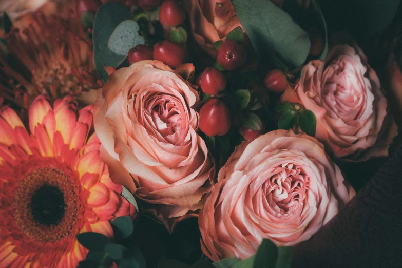 a bunch of flowers sitting on top of a table, pexels, romanticism, toned orange and pastel pink, made of flowers and berries, laying on roses, upclose