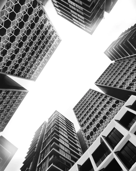 a black and white photo of tall buildings, by Adam Rex, pexels contest winner, brutalism, hexagons, trypophobia, square shapes, melbourne