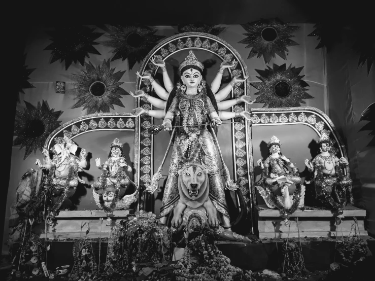 a black and white photo of a statue, by Caroline Mytinger, pexels, bengal school of art, 3 spring deities, shrines, david la chapelle, festivals