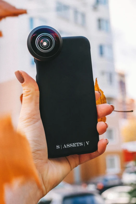 a person holding a cell phone with a camera attached to it, by Sebastian Vrancx, unsplash, photorealism, instagram story, axsens, shades, official product image