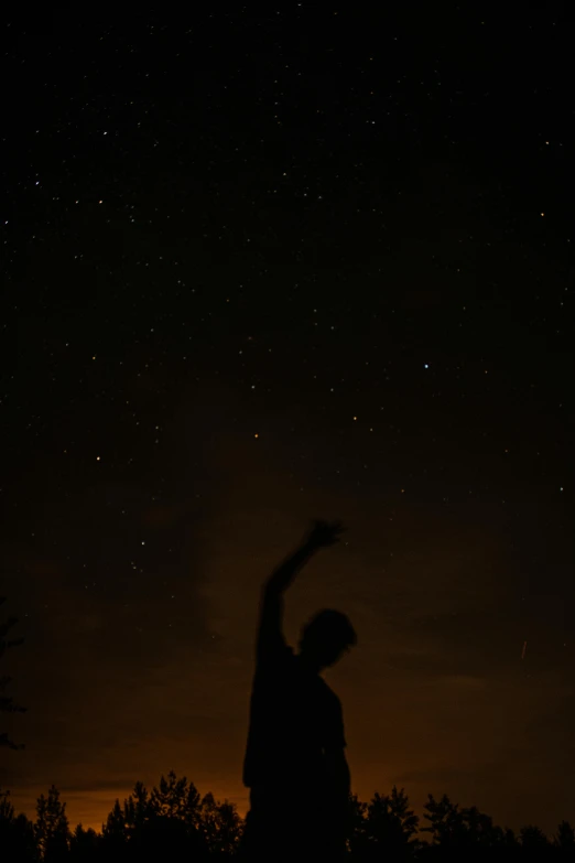 a person standing under a sky full of stars, by Attila Meszlenyi, he is dancing, low quality photo