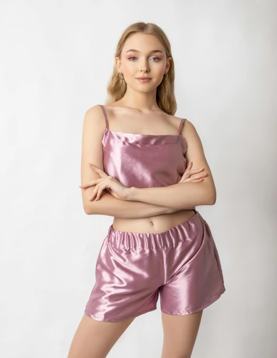 a woman wearing a pink satin top and shorts, ((purple)), full product shot, eleanor tomlinson, sleepwear