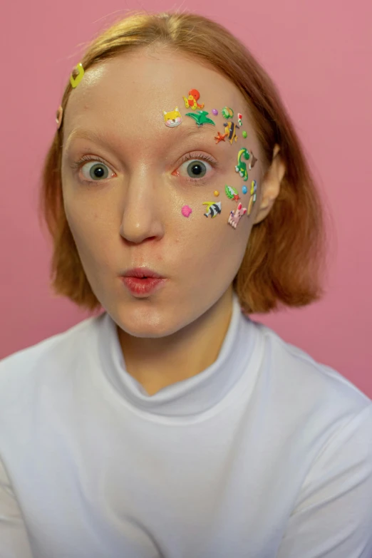 a woman with sprinkles on her face, an album cover, inspired by Hannah Frank, trending on pexels, holo sticker, aesthetic cute with flutter, low quality photo, face photo
