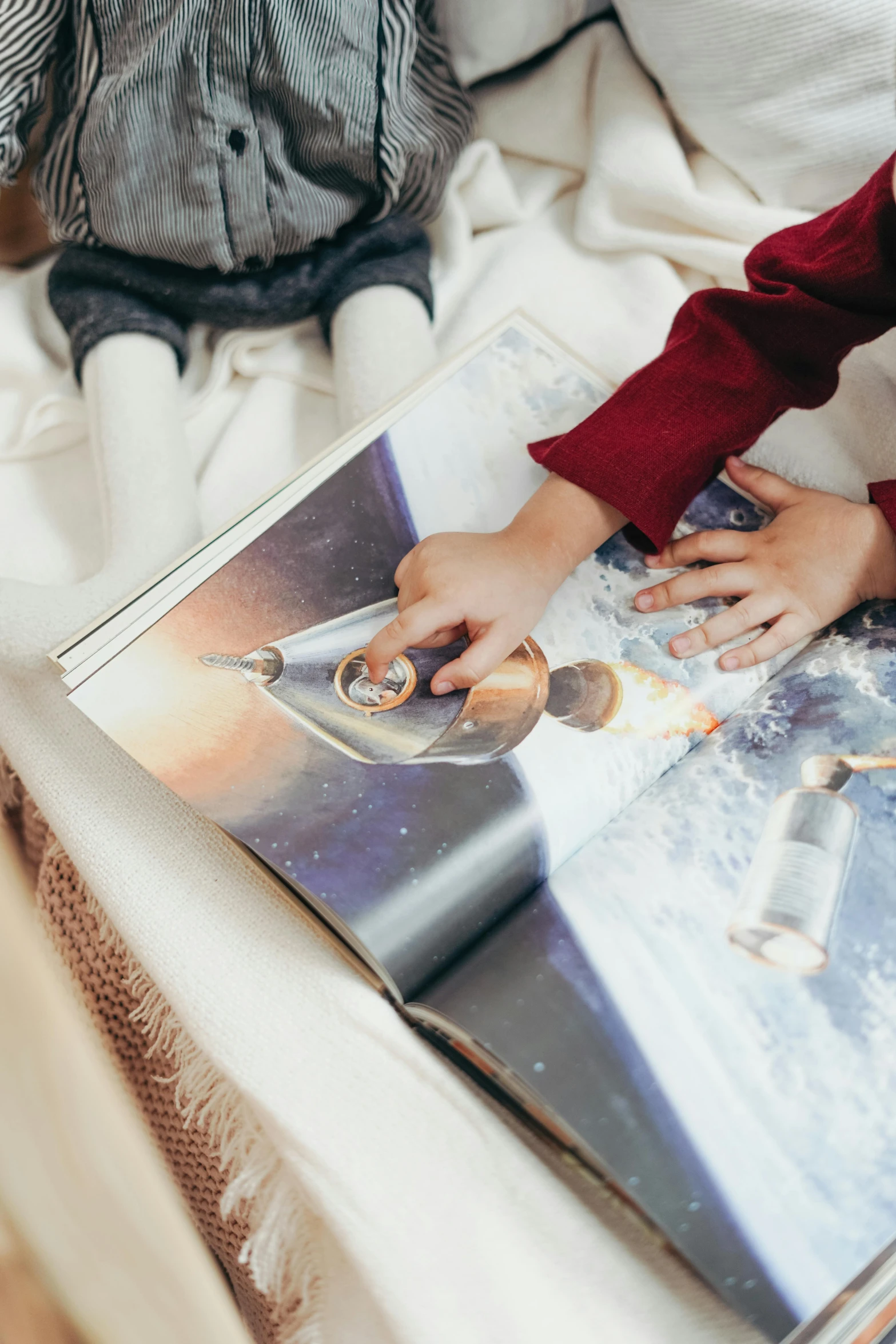 a little boy sitting on a bed reading a book, pexels contest winner, process art, space craft, close - up photograph, of a family leaving a spaceship, detailed product image