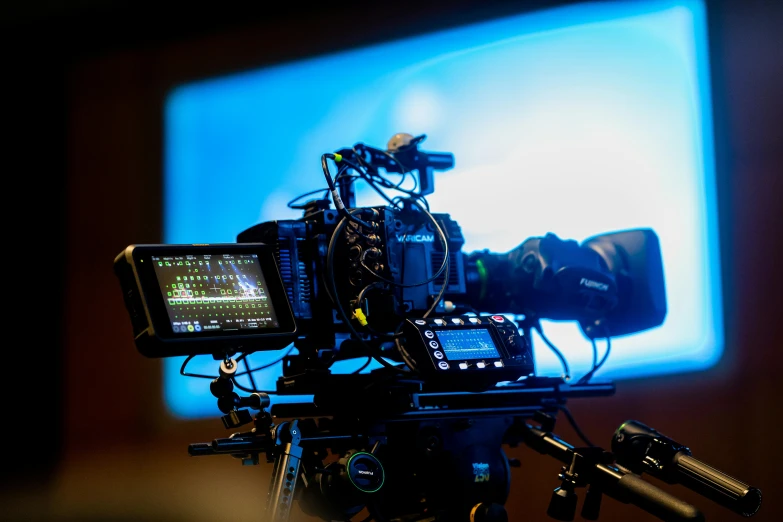 a close up of a camera on a tripod, shutterstock, video art, cinematic blue lighting, panels, monitor, sony a 7 s