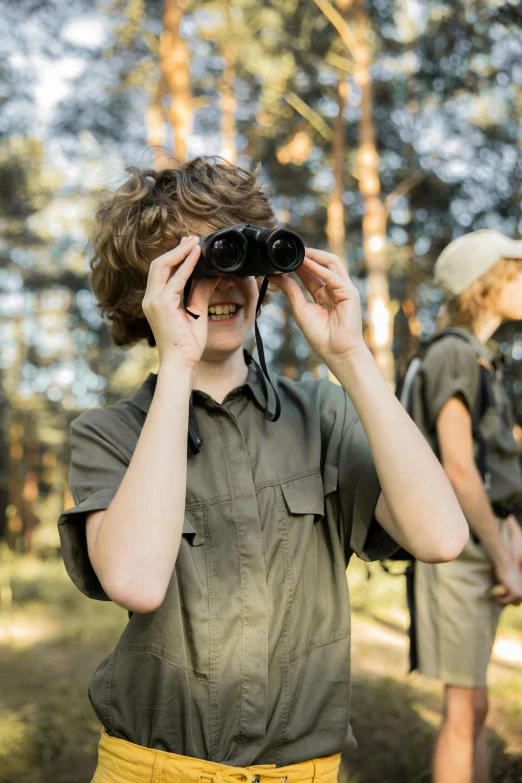 a group of people standing in a forest looking through binoculars, by Terese Nielsen, shutterstock, teen boy, dressed as a scavenger, safari, instagram post