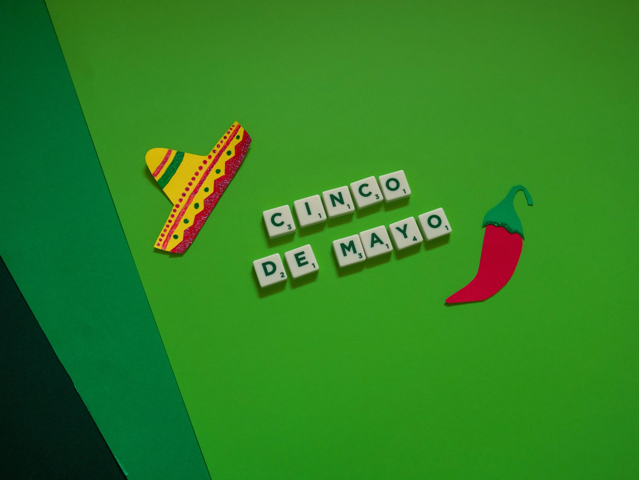 a sign that says cinco de mayo next to a chili pepper, trending on unsplash, graffiti, a rubik's cube, clemens ascher, green, background image