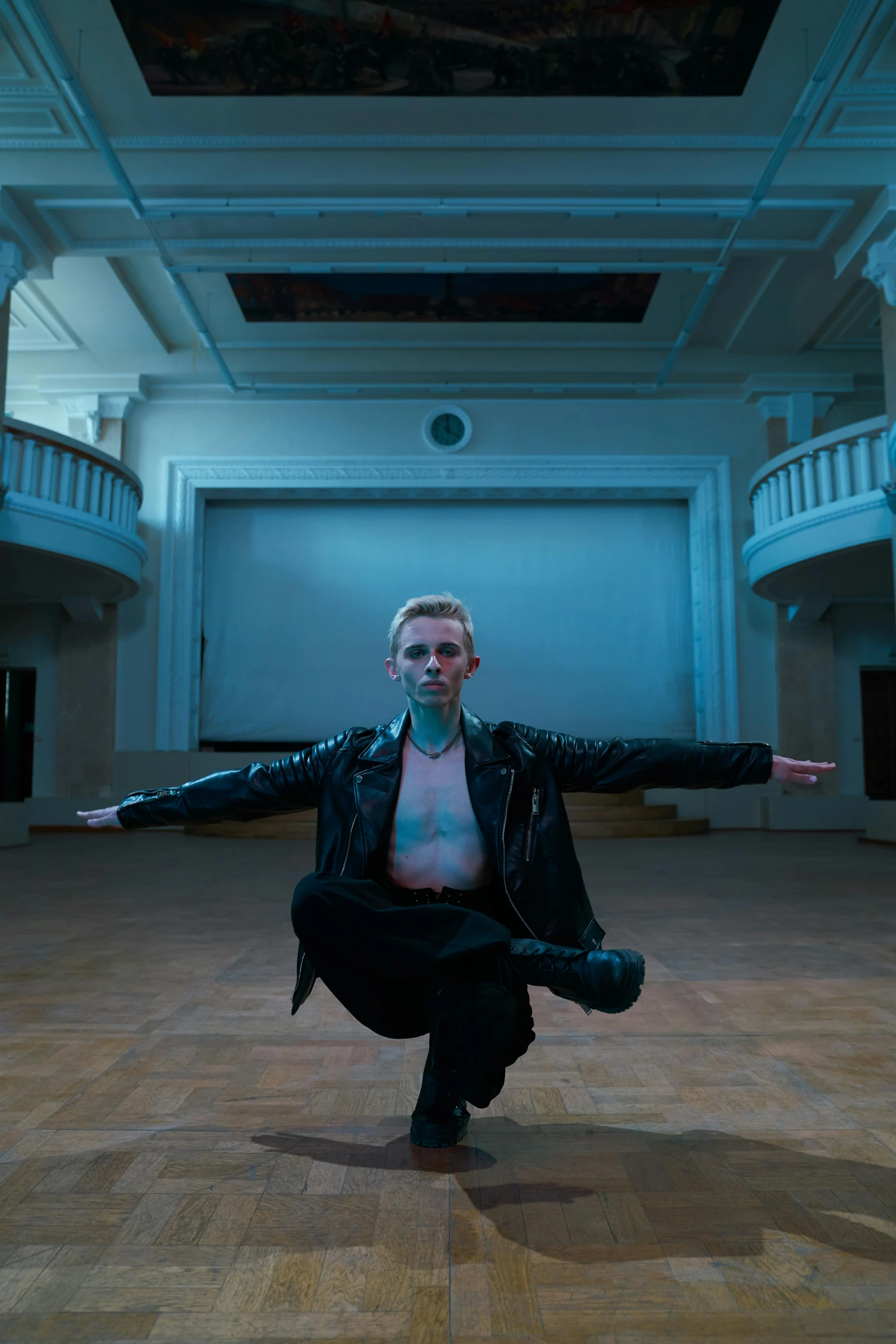 a woman doing a yoga pose in a large room, an album cover, antipodeans, an epic non - binary model, irina nordsol kuzmina, high quality photo, elize theron