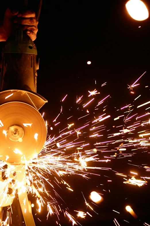 a person using a grinder on a fire hydrant, pexels contest winner, process art, welding torches for arms, panoramic shot, steel blades, album cover