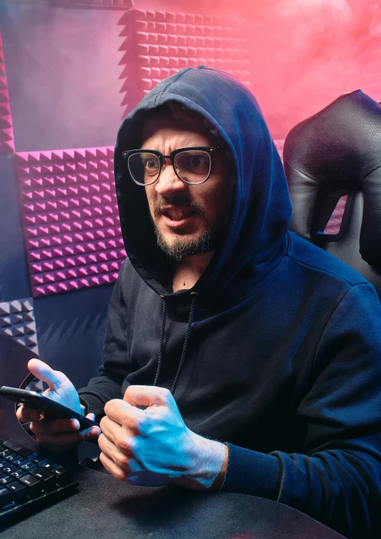 a man in a hoodie sitting in front of a laptop, featured on reddit, antipodeans, with glasses and goatee, playing video games, 2 5 6 x 2 5 6 pixels, youtube thumbnail