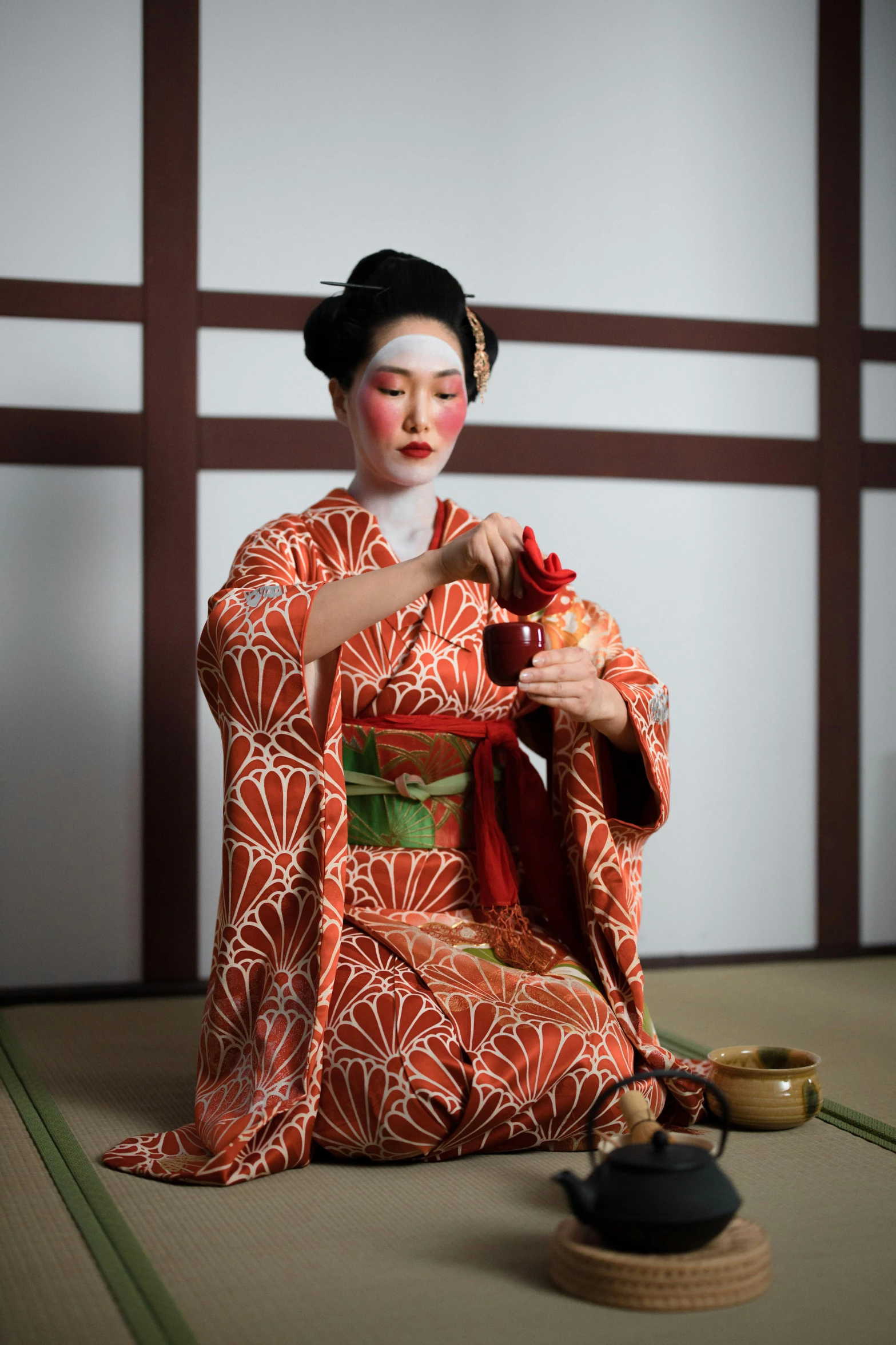 a woman in a kimono sitting on the floor, a portrait, inspired by Tosa Mitsunobu, pexels contest winner, square, tea ceremony scene, ( ( theatrical ) ), slide show