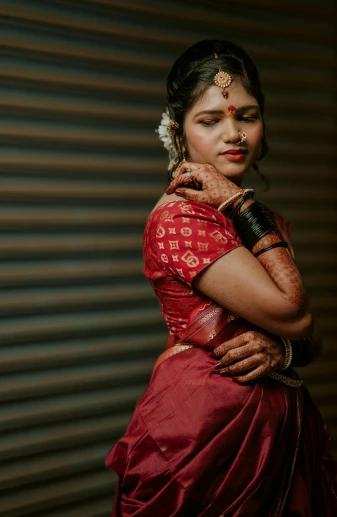 a woman in a red dress posing for a picture, by Max Dauthendey, pexels contest winner, hurufiyya, dressed in a sari, teenage girl, intricate details. front on, vintage look