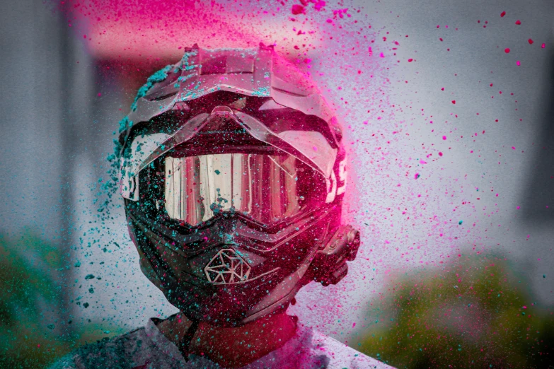 a close up of a person wearing a helmet and goggles, pexels contest winner, action painting, ((pink)), all colors, desaturated, iridescent visor