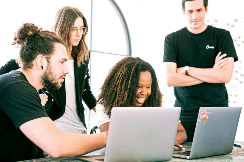 a group of people sitting around a table with laptops, by Carey Morris, trending on unsplash, avatar image, 9 9 designs, “ iron bark, looking at monitor