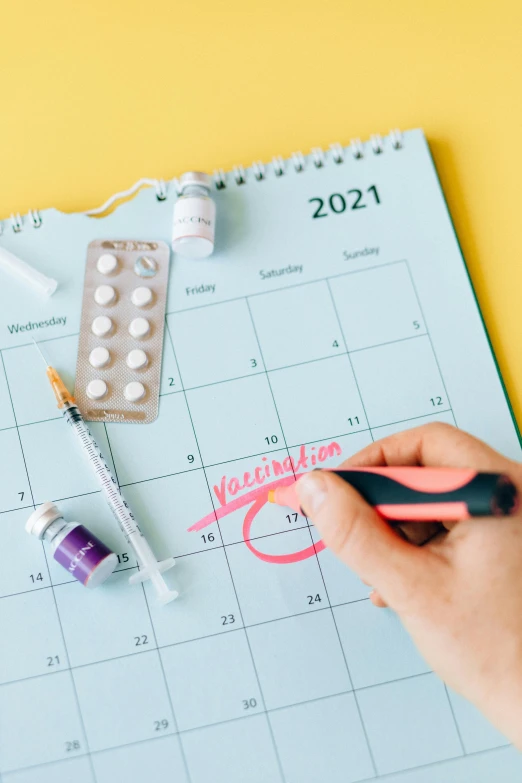 a close up of a person writing on a calendar, a picture, by Nicolette Macnamara, shutterstock, happening, holding a syringe, contracept, 1 6 x 1 6, where a large