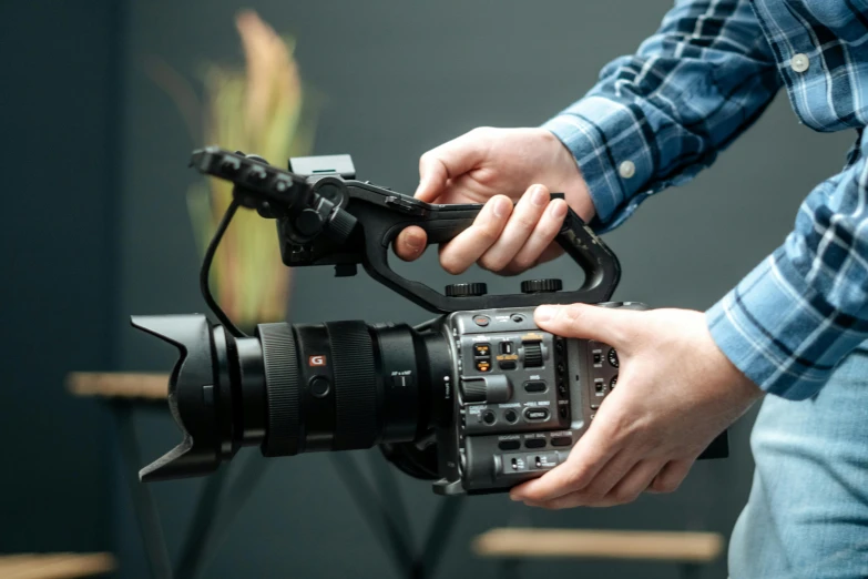 a close up of a person holding a camera, sony fx 6, b - roll, instagram post, cinematic ， - h 7 6 8