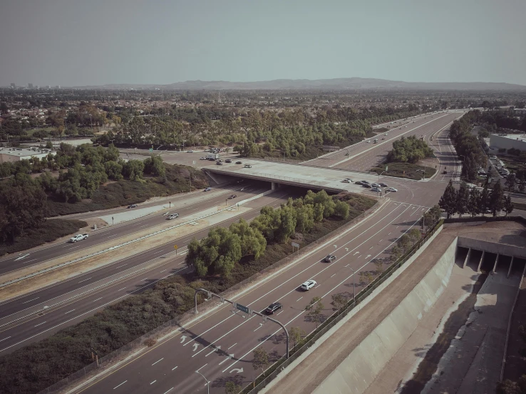 an aerial view of a highway and a freeway, unsplash, photorealism, instagram photo, no people 4k, 1970s photo, realistic ”