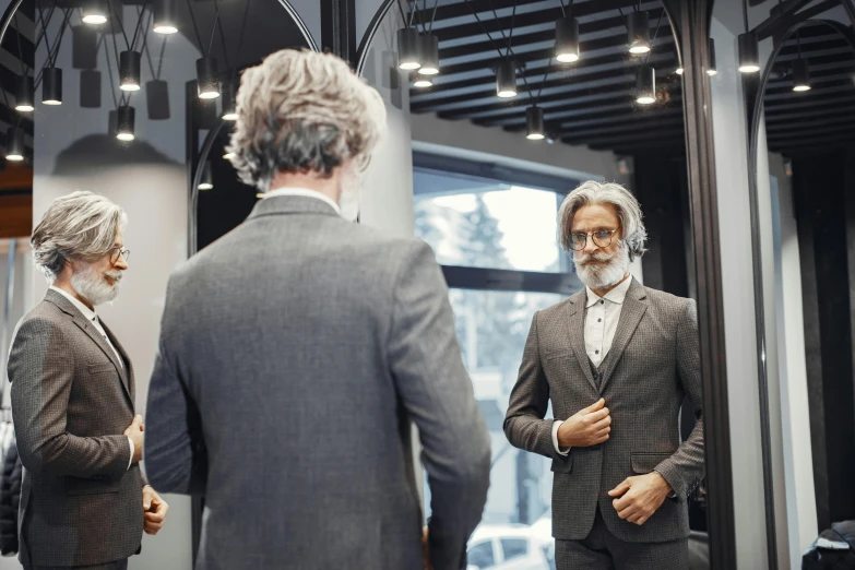 a man in a suit standing in front of a mirror, gray beard, commercial, thumbnail, put on a mannequin