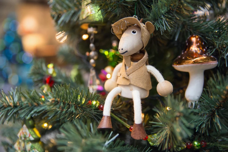 a close up of a christmas tree with ornaments on it, inspired by Ernest William Christmas, camel, deerstalker, wooden, fully posable