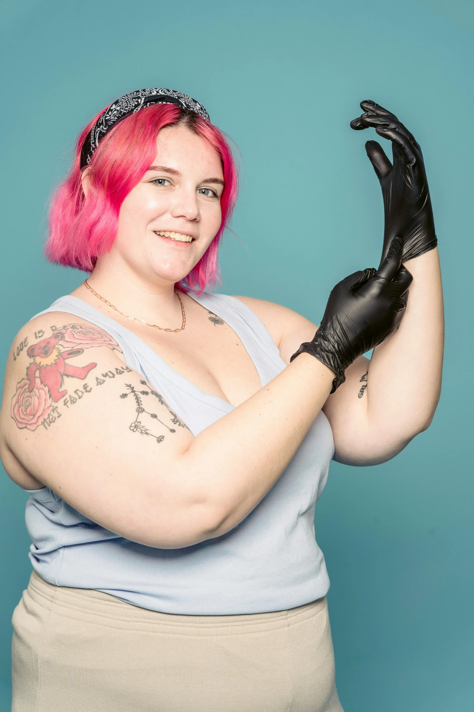 a woman with pink hair wearing black gloves, featured on reddit, slightly overweight, nonbinary model, with index finger, jenna barton