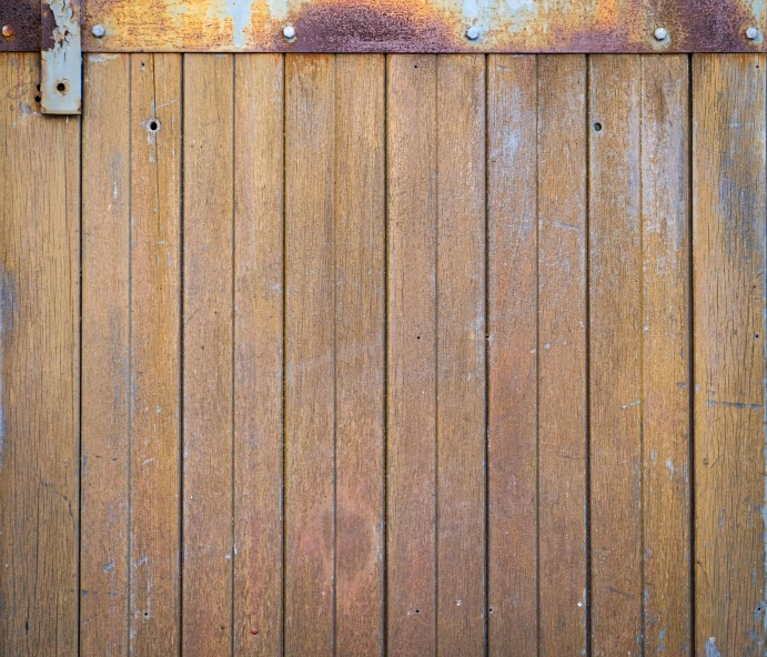 a close up of a wooden door with rust, inspired by Tom Roberts, unsplash, background image, metal panels, 1 4 9 3, brown