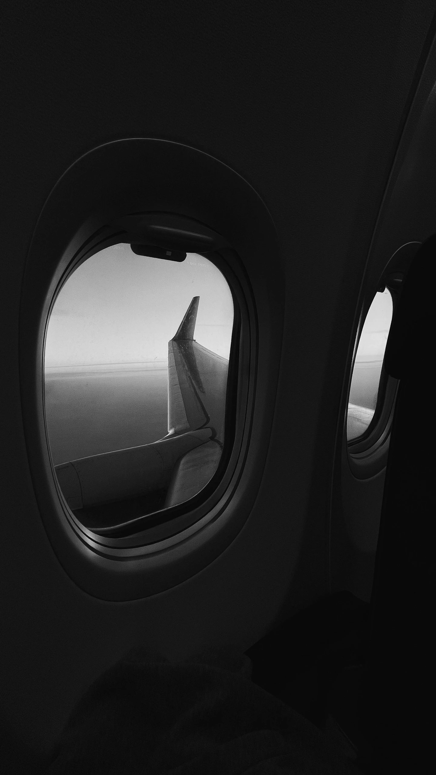 a black and white photo of the inside of an airplane, inspired by Pierre Pellegrini, unsplash, conceptual art, spaceship window, monochrome 3 d model, thumbnail, 8 k photo