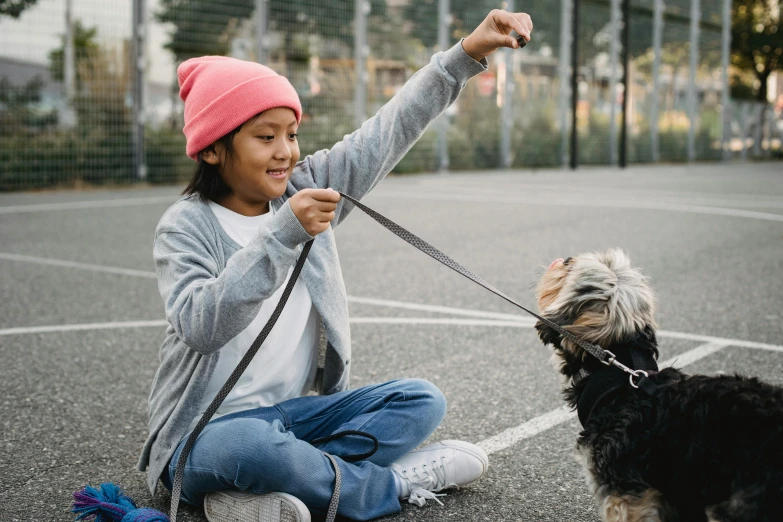 a little girl sitting on the ground with a dog, pexels contest winner, square, thumbnail, collar and leash, schools