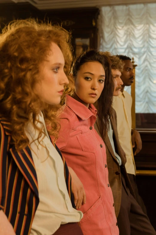 a group of women standing next to each other, inspired by Wes Anderson, pexels, renaissance, julia garner, saturday night in a saloon, movie scene close up, mixed race