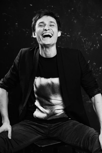 a black and white photo of a man laughing, a black and white photo, by Federico Zuccari, pexels, dada, jonny greenwood, jim carrey as the joker, neal adams | portrait, anna nikonova