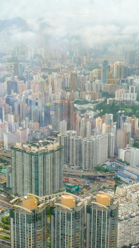 an aerial view of a city with lots of tall buildings, happening, kakar cheung, 8 k hi - res, no crop, gigapixel photo