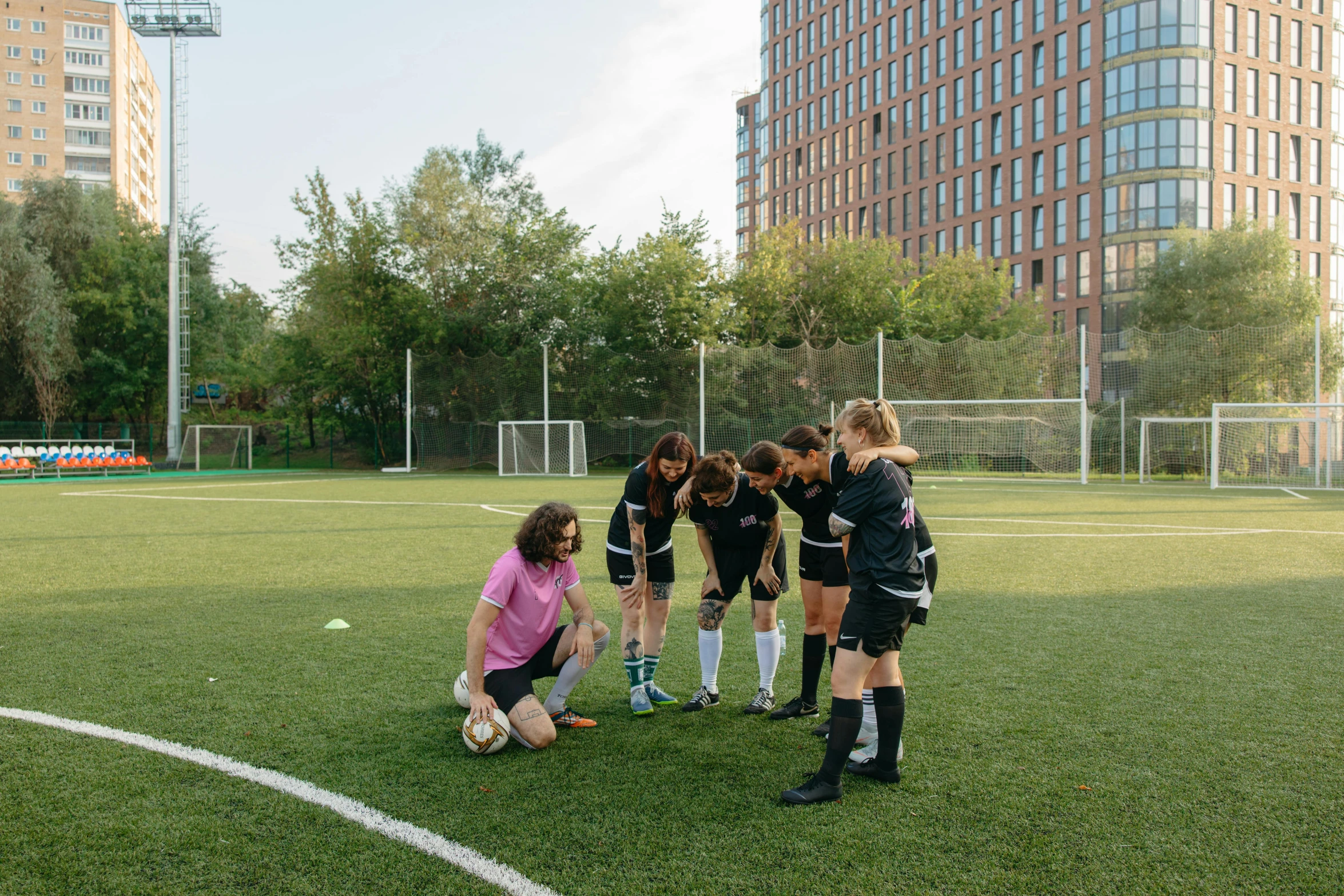 a group of young women standing on top of a soccer field, by Julia Pishtar, pexels contest winner, ashcan school, calmly conversing 8k, outside on the ground, van lieven, xue han