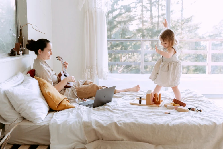 a woman and a child on a bed with a laptop, pexels contest winner, figuration libre, is playing a lute, full-body, manuka, youtube thumbnail